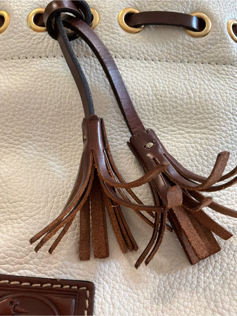 Dooney & Bourke White Pebbled Leather Satchel with Brown Trim and Tassel